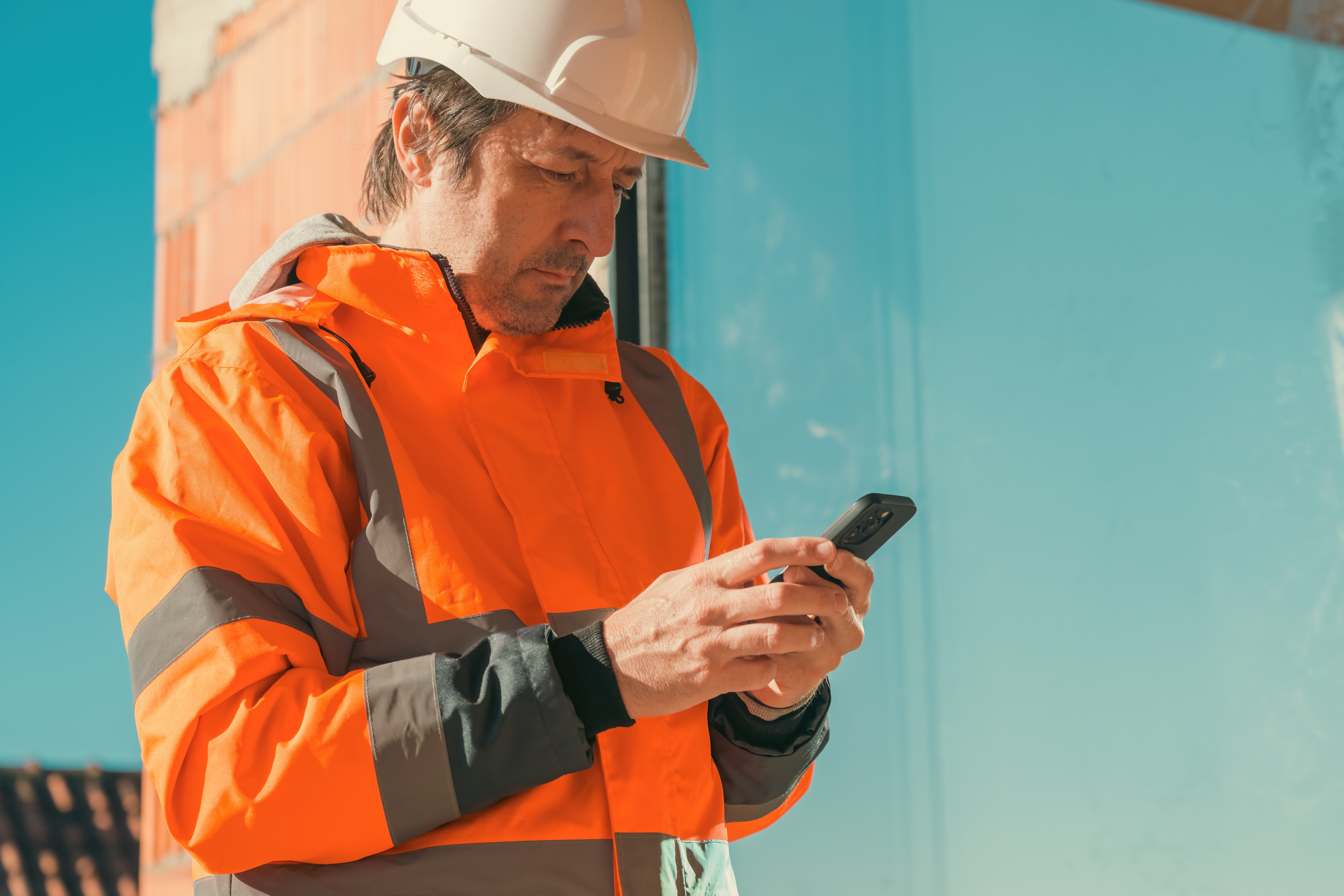 Construction site worker using digital forms